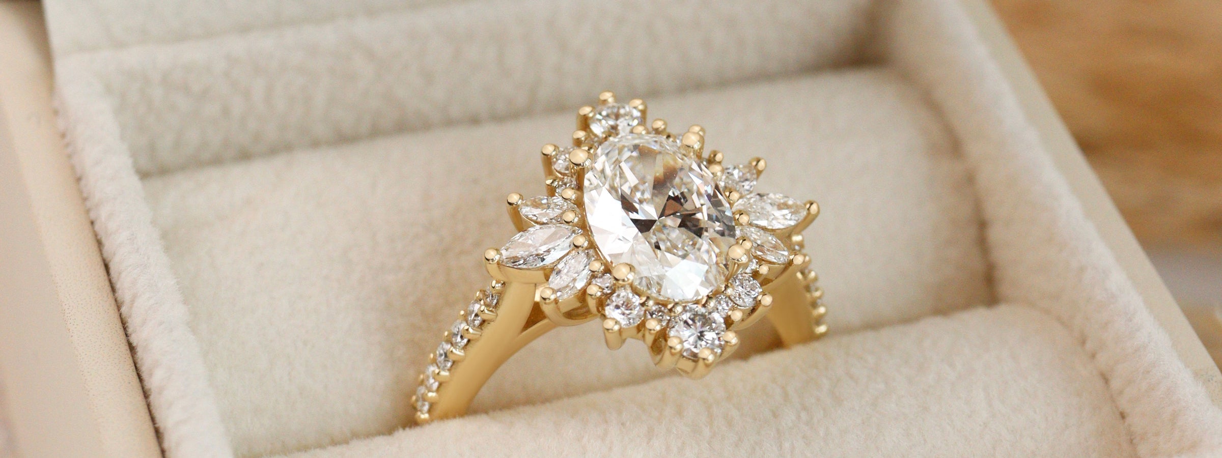 Oval halo engagement ring with pavé accents