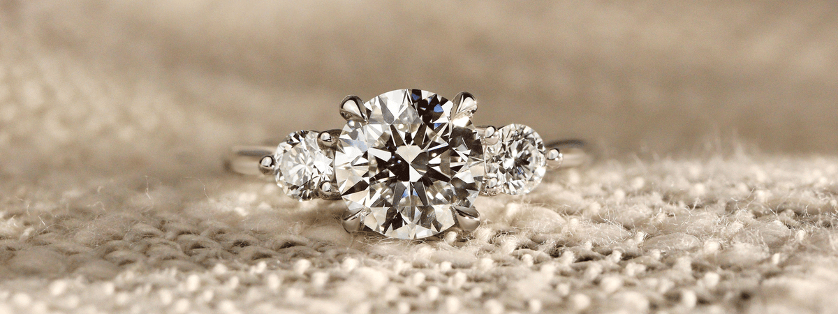 round diamond three stone engagement rings