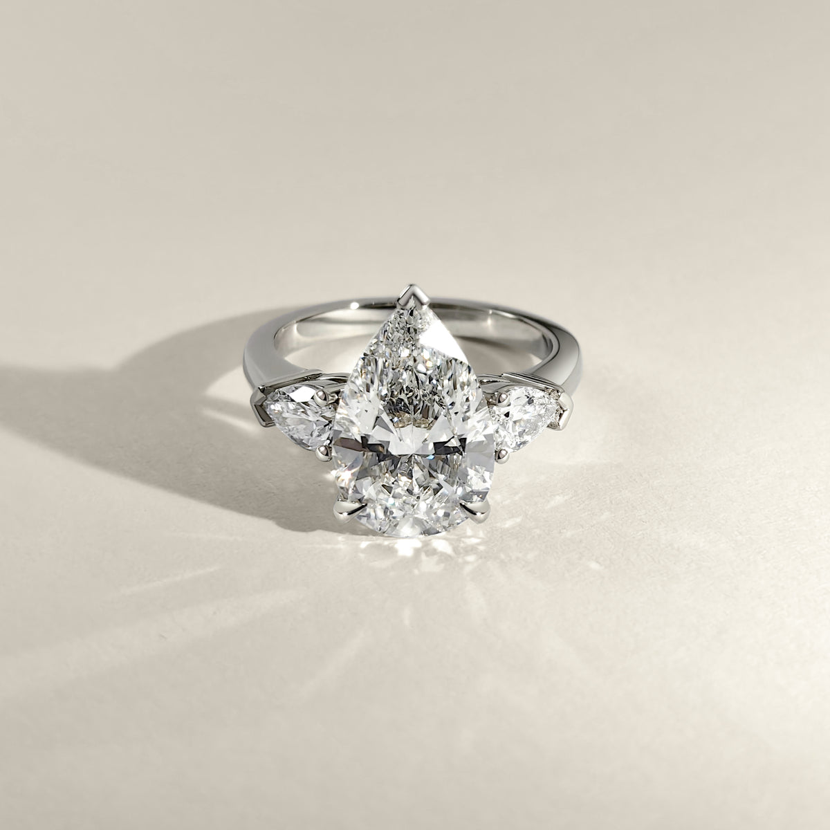 3.5ct-pear-cut-lab-diamond-three-stone-engagement-ring