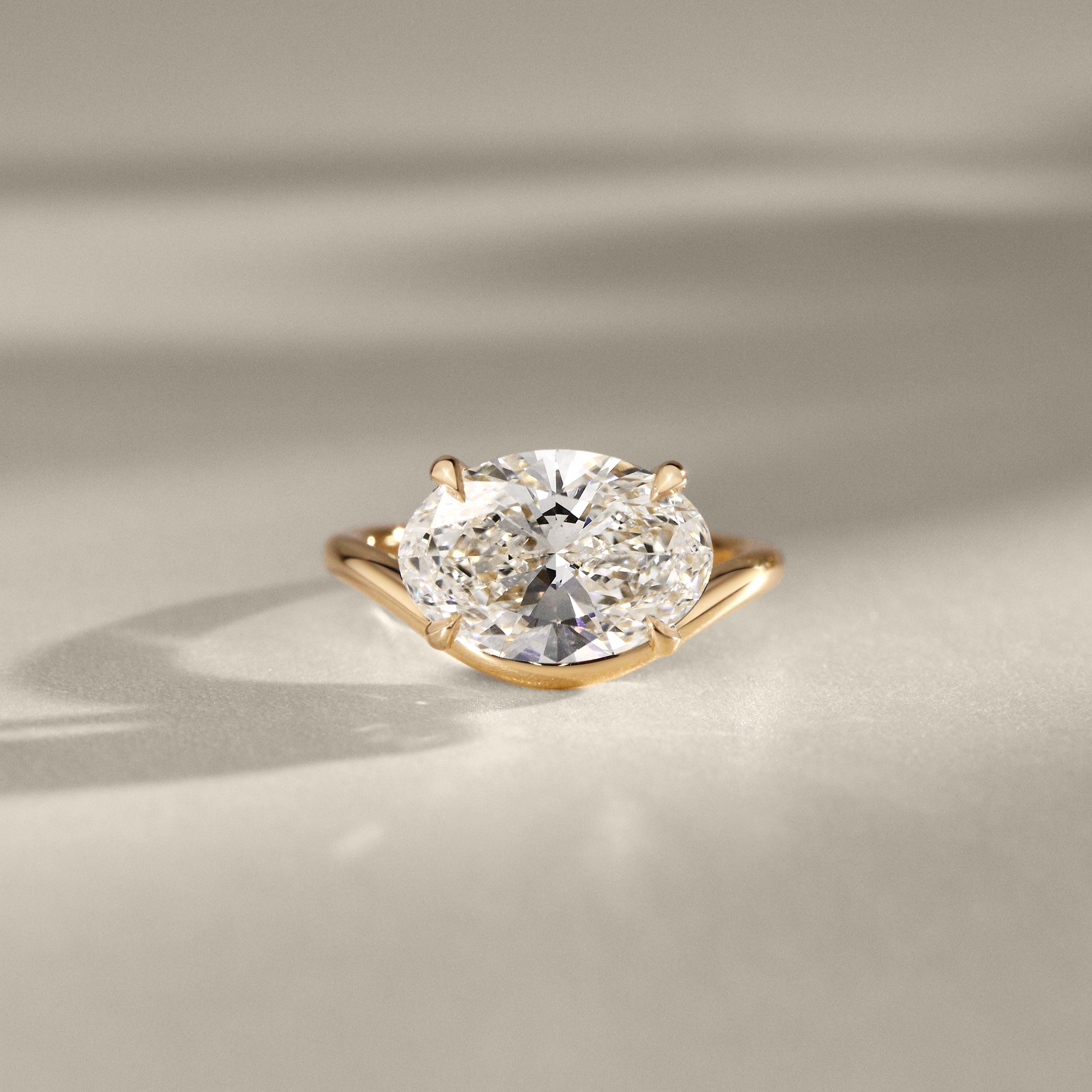 Orla Curved Band Solitaire Engagement Ring, Oval Cut