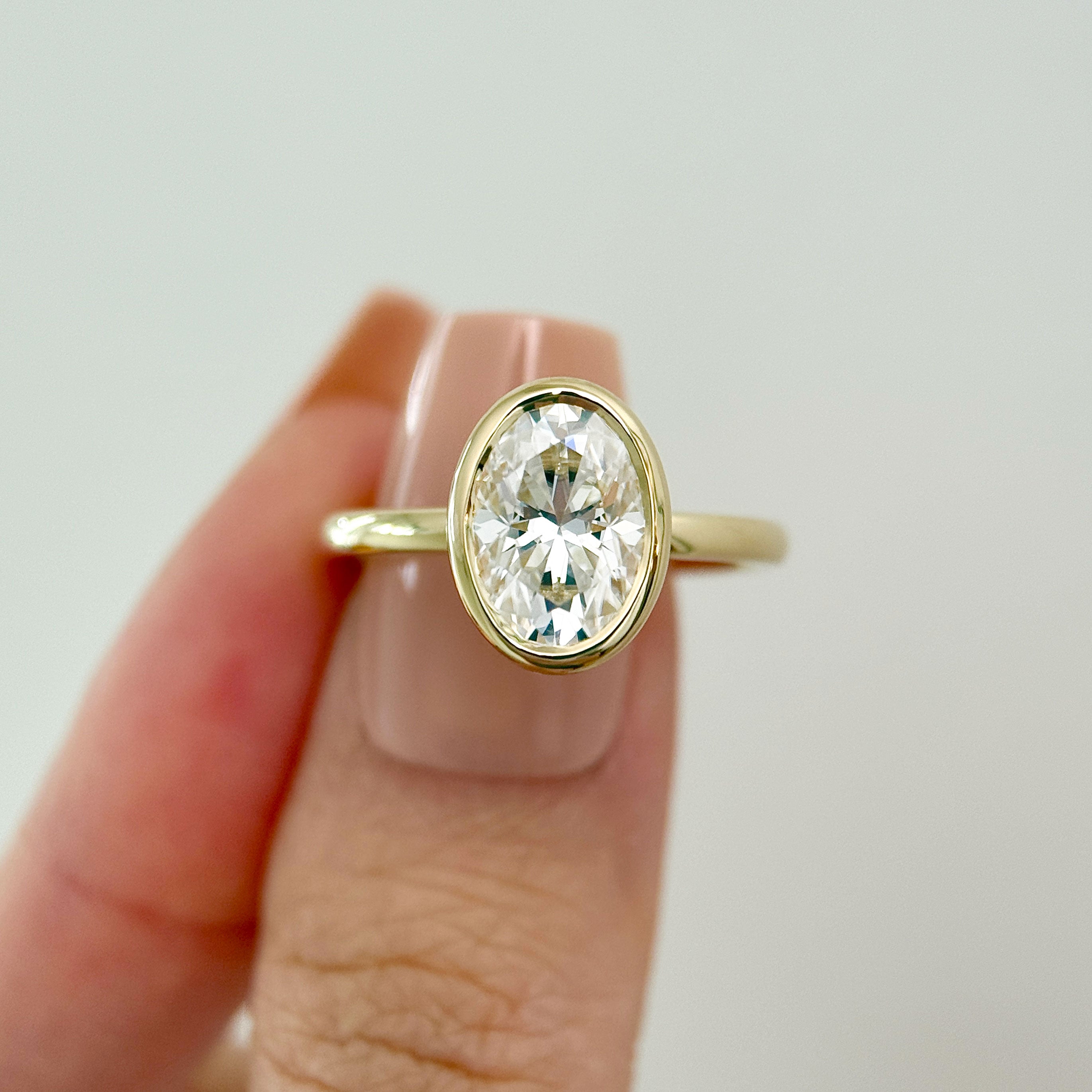 Carmen Oval Cut Full Bezel Cathedral Solitaire Engagement Ring