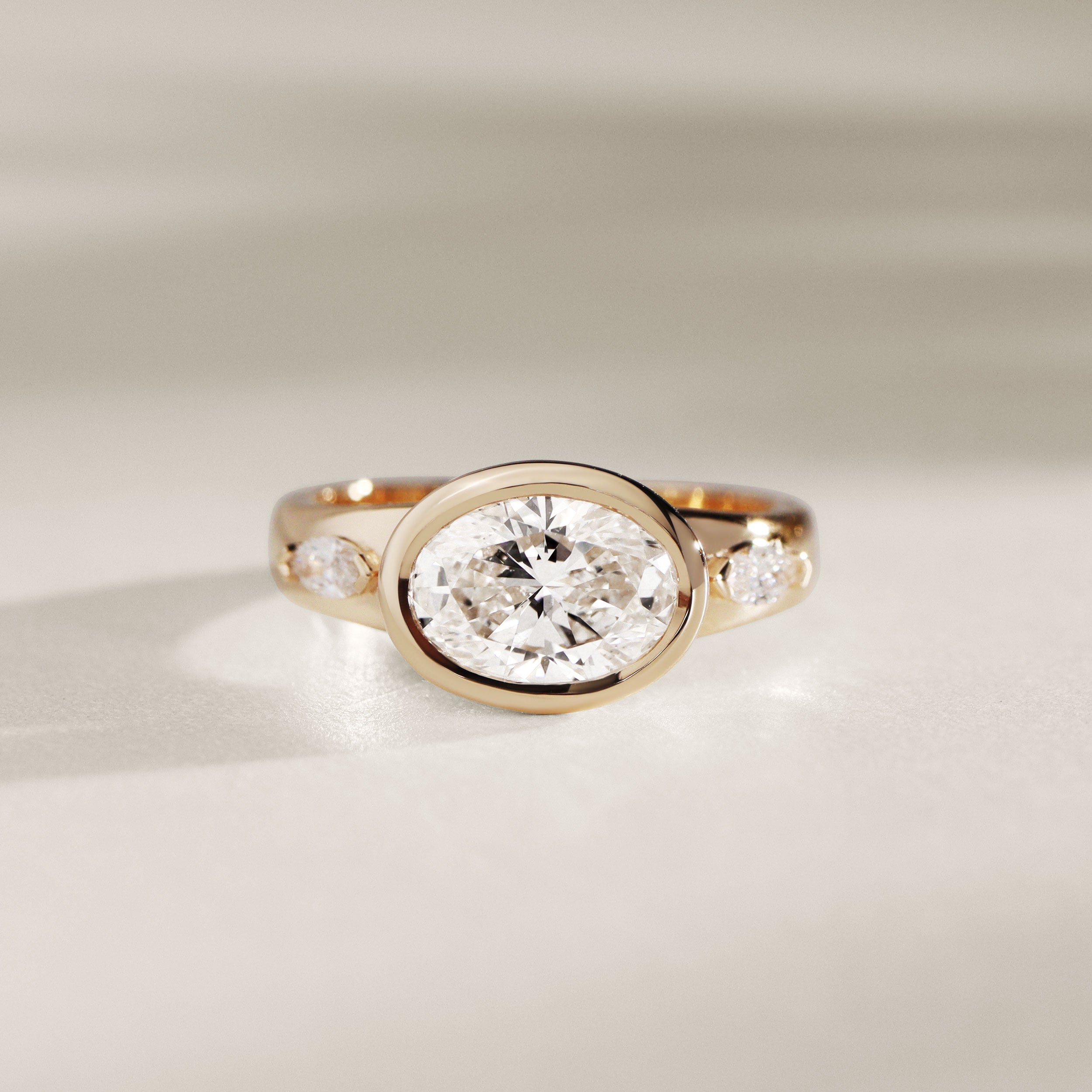 Bespoke #9165 - Custom East-West Oval Bezel Engagement Ring w/ 3.5mm Flare Band