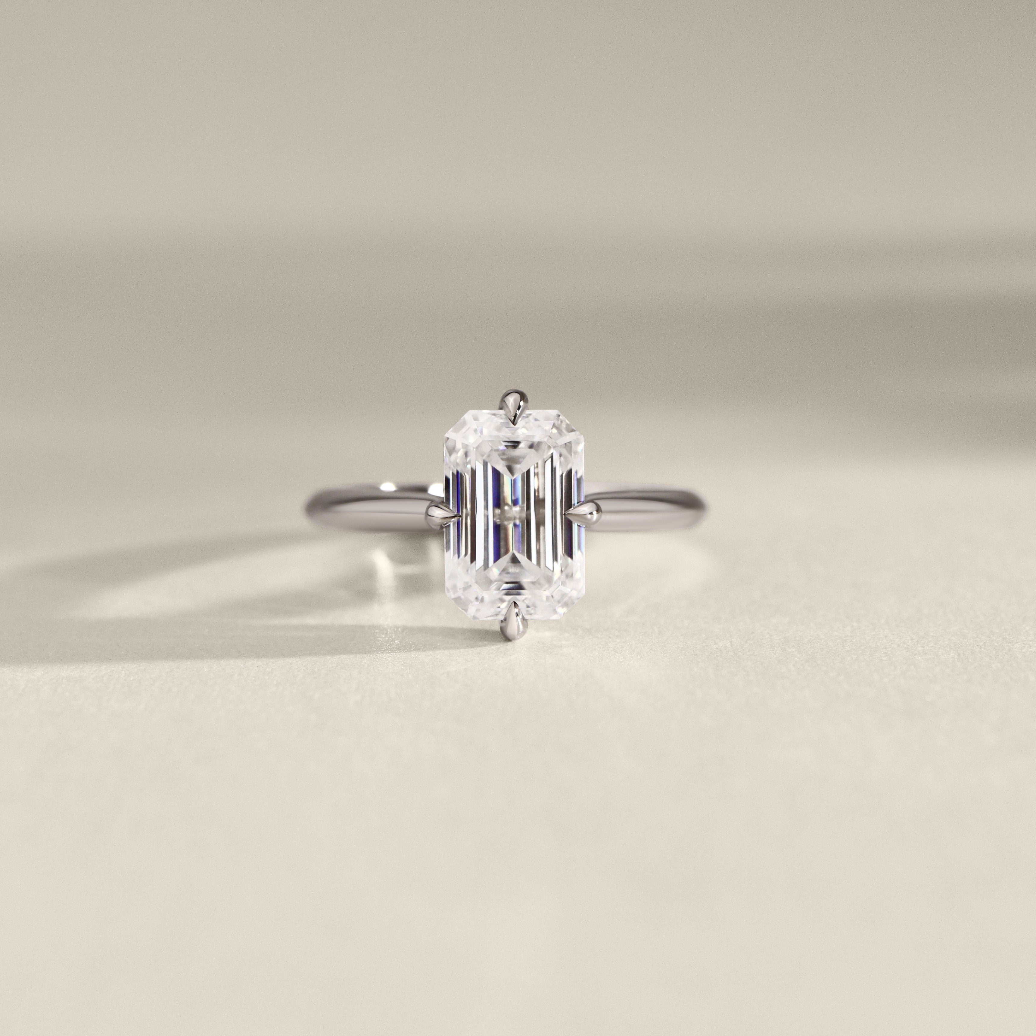 Jodie Compass Emerald Cut Hidden Halo Engagement Ring