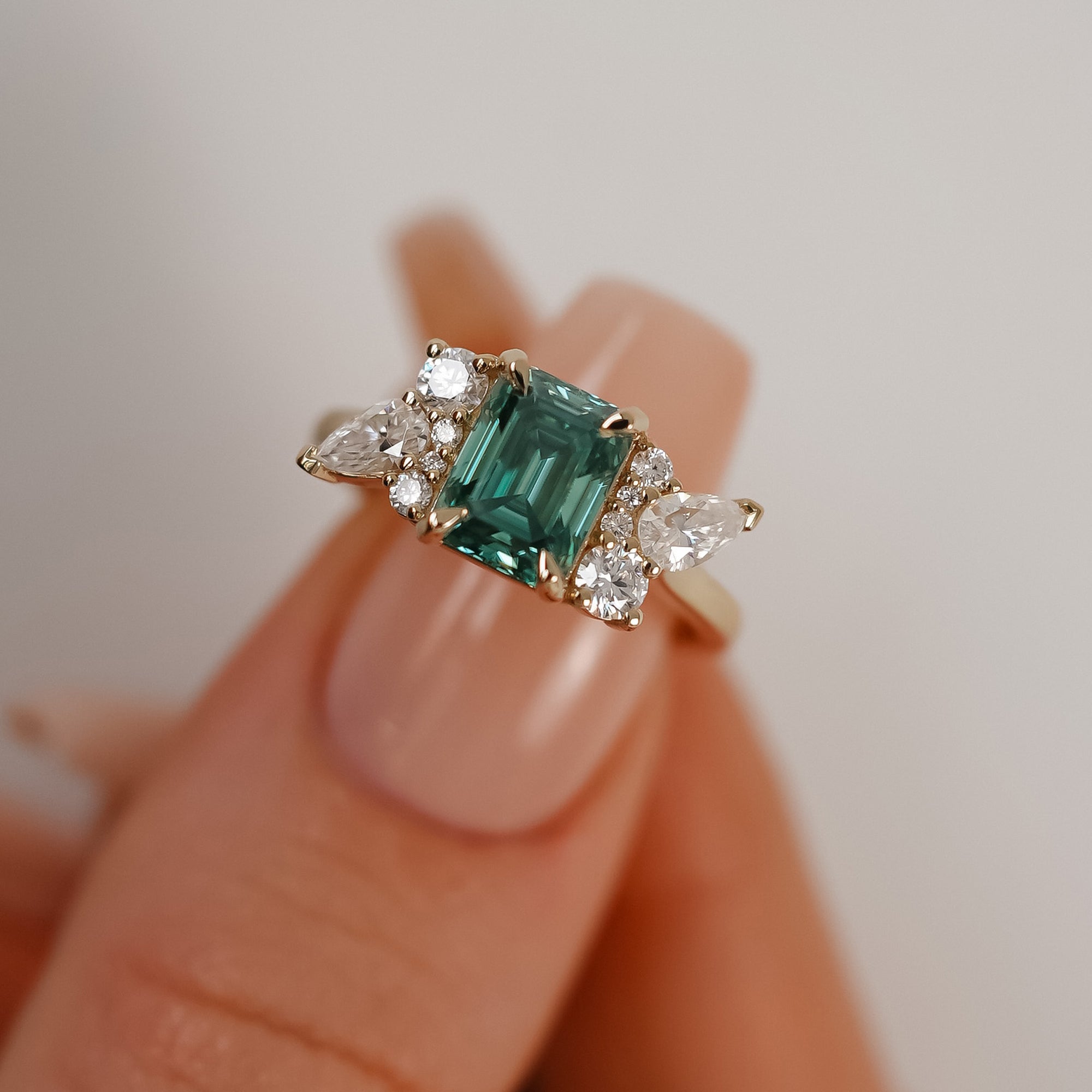 Meghan Emerald Cut Asymmetric Cluster Engagement Ring