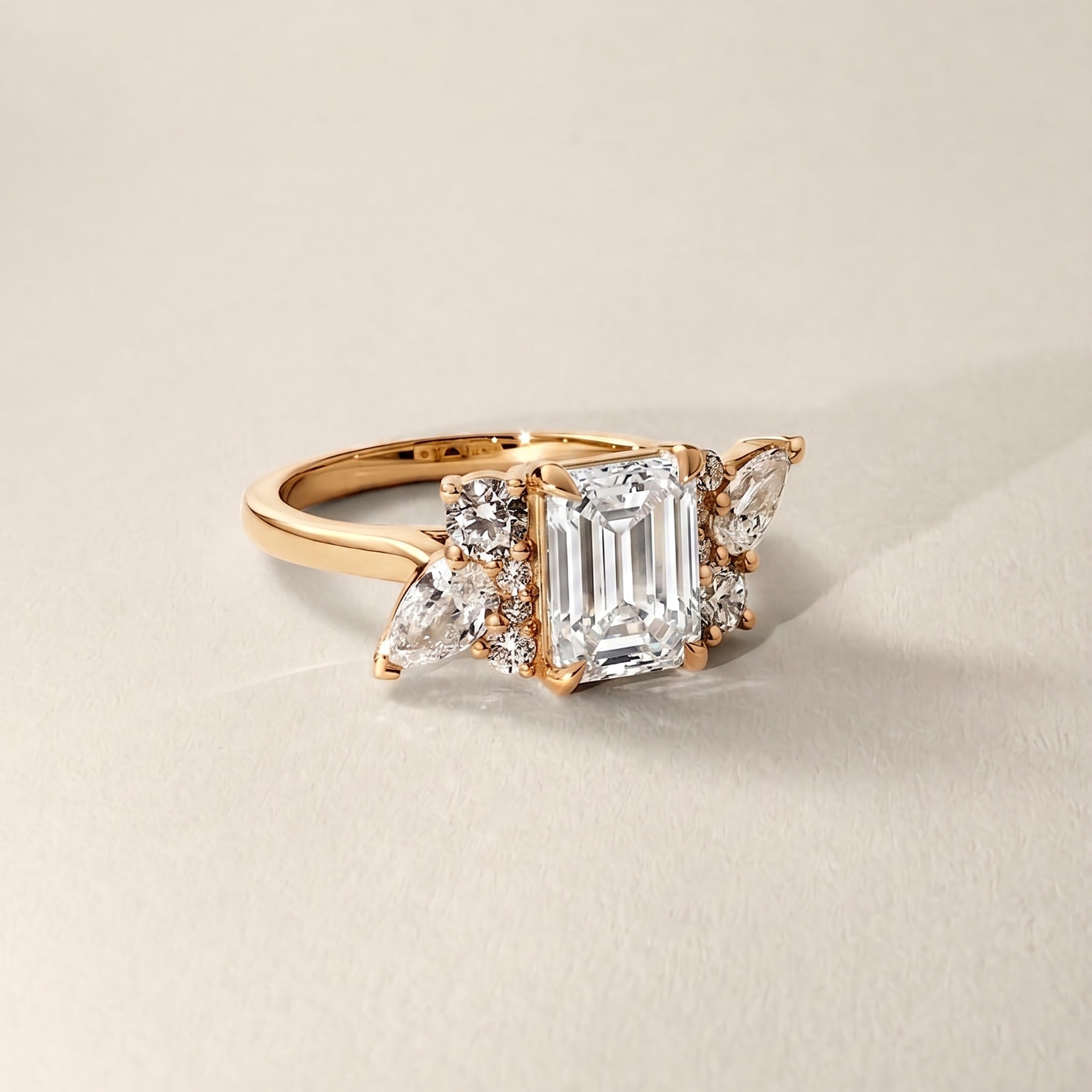 Meghan Emerald Cut Asymmetric Cluster Engagement Ring