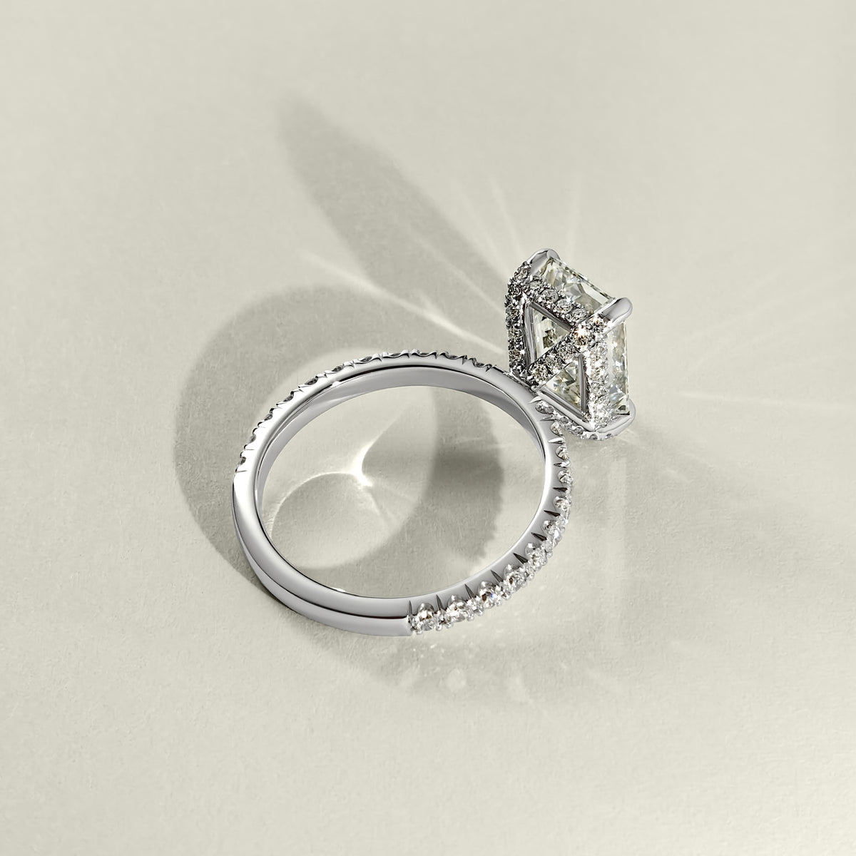 pave crown hidden halo emerald cut engagement ring