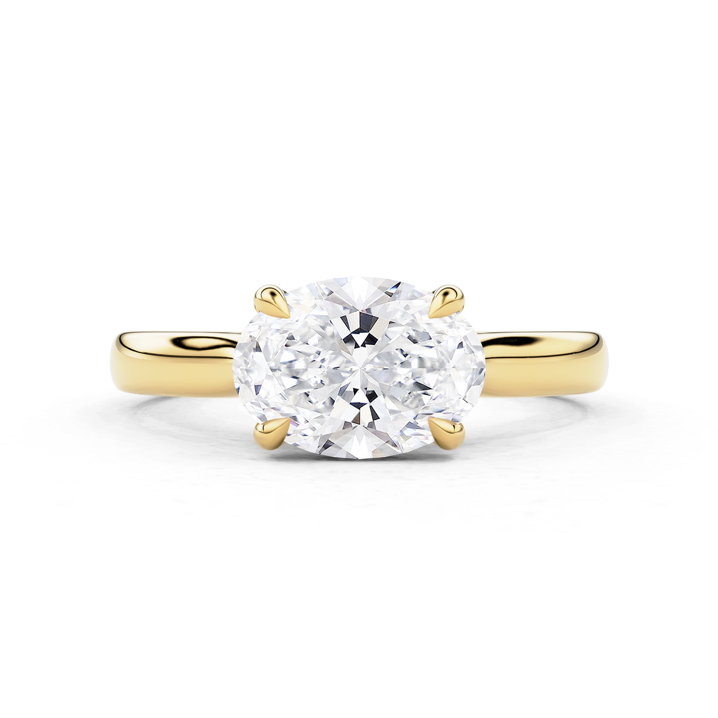 east west oval engagement ring in yellow gold