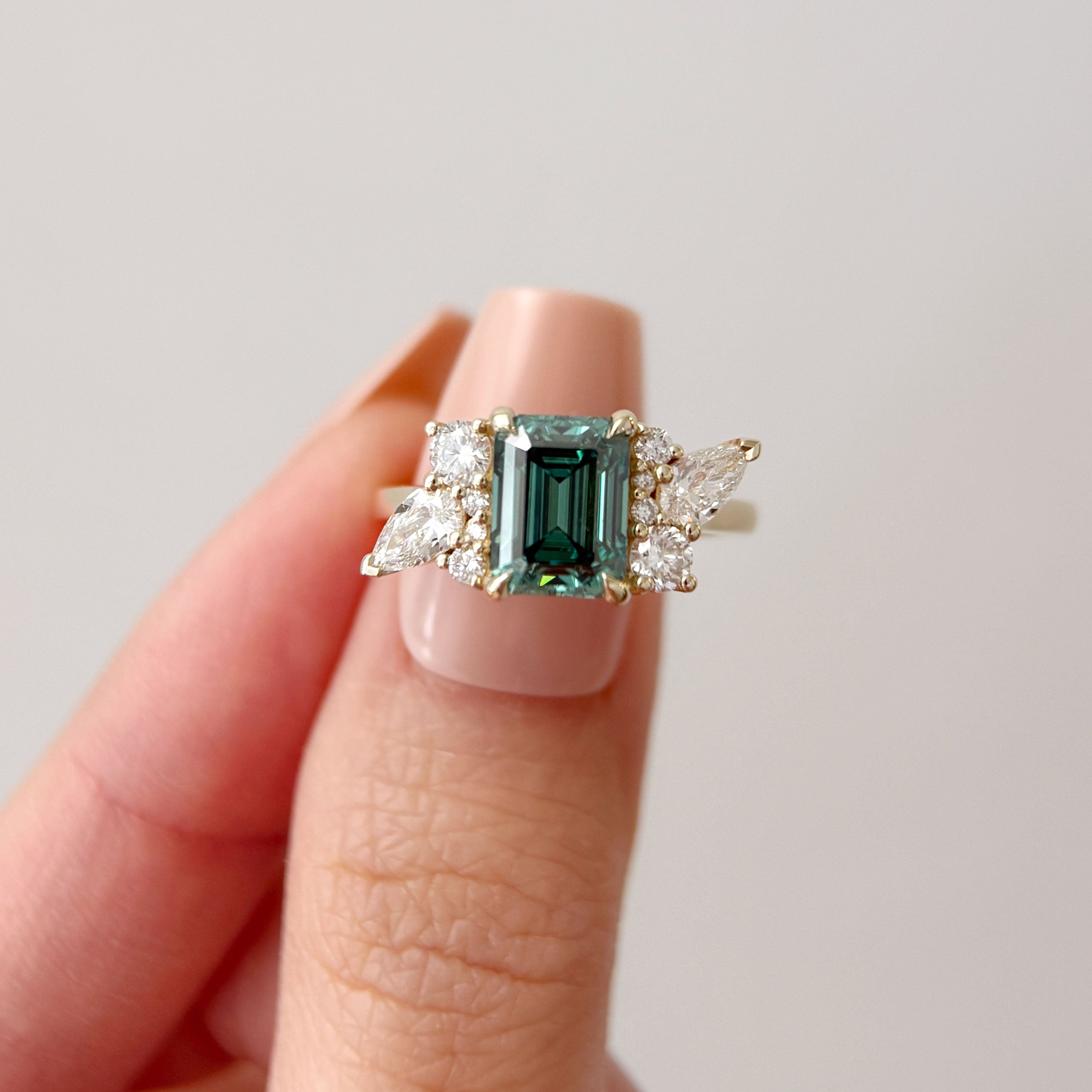 Meghan Emerald Cut Asymmetric Cluster Engagement Ring