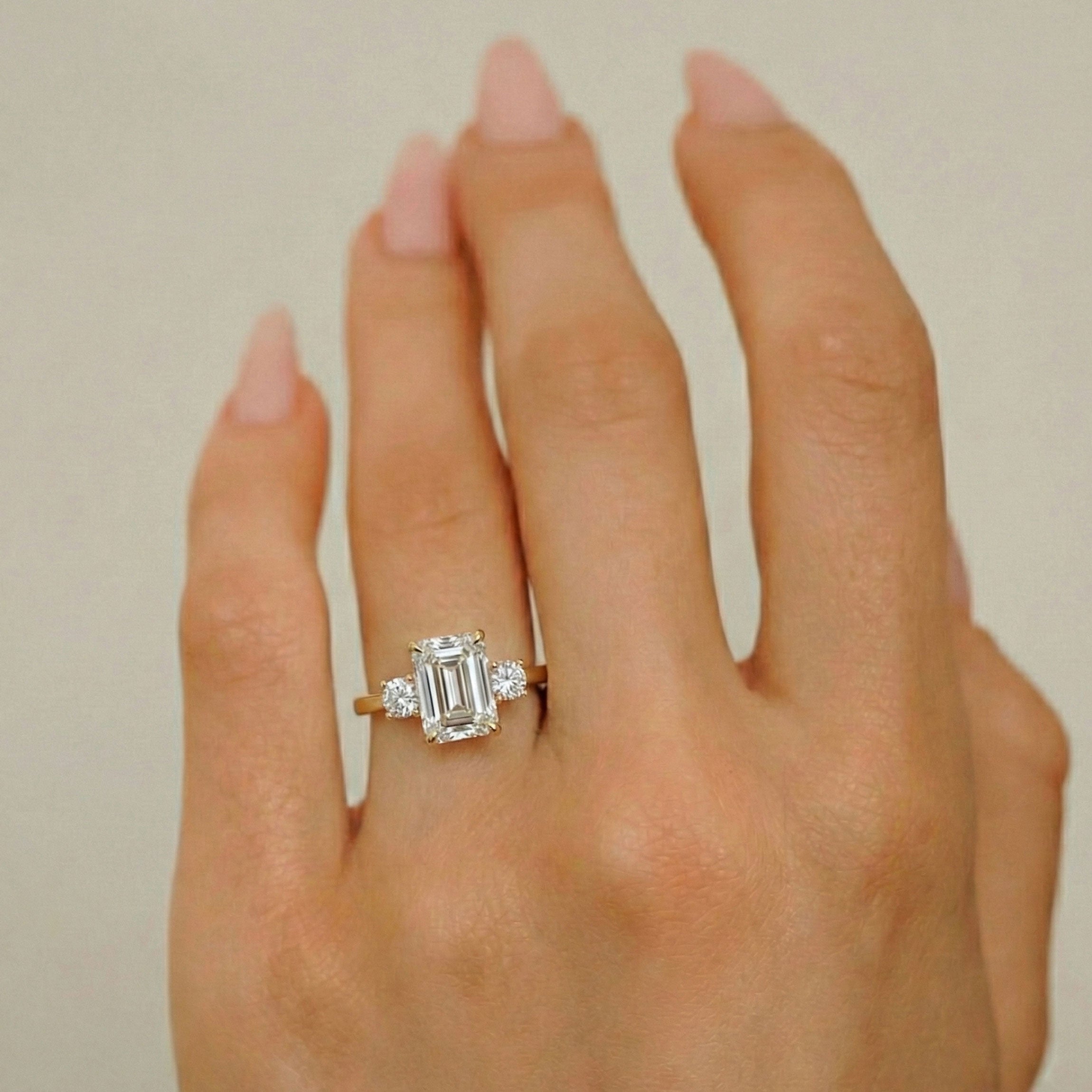 Glamour Emerald Cut Three Stone Engagement Ring, With Round Accent