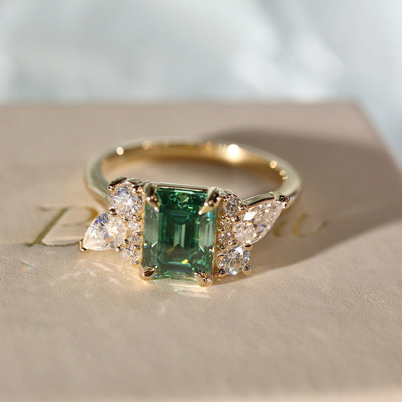 Meghan Emerald Cut Asymmetric Cluster Engagement Ring