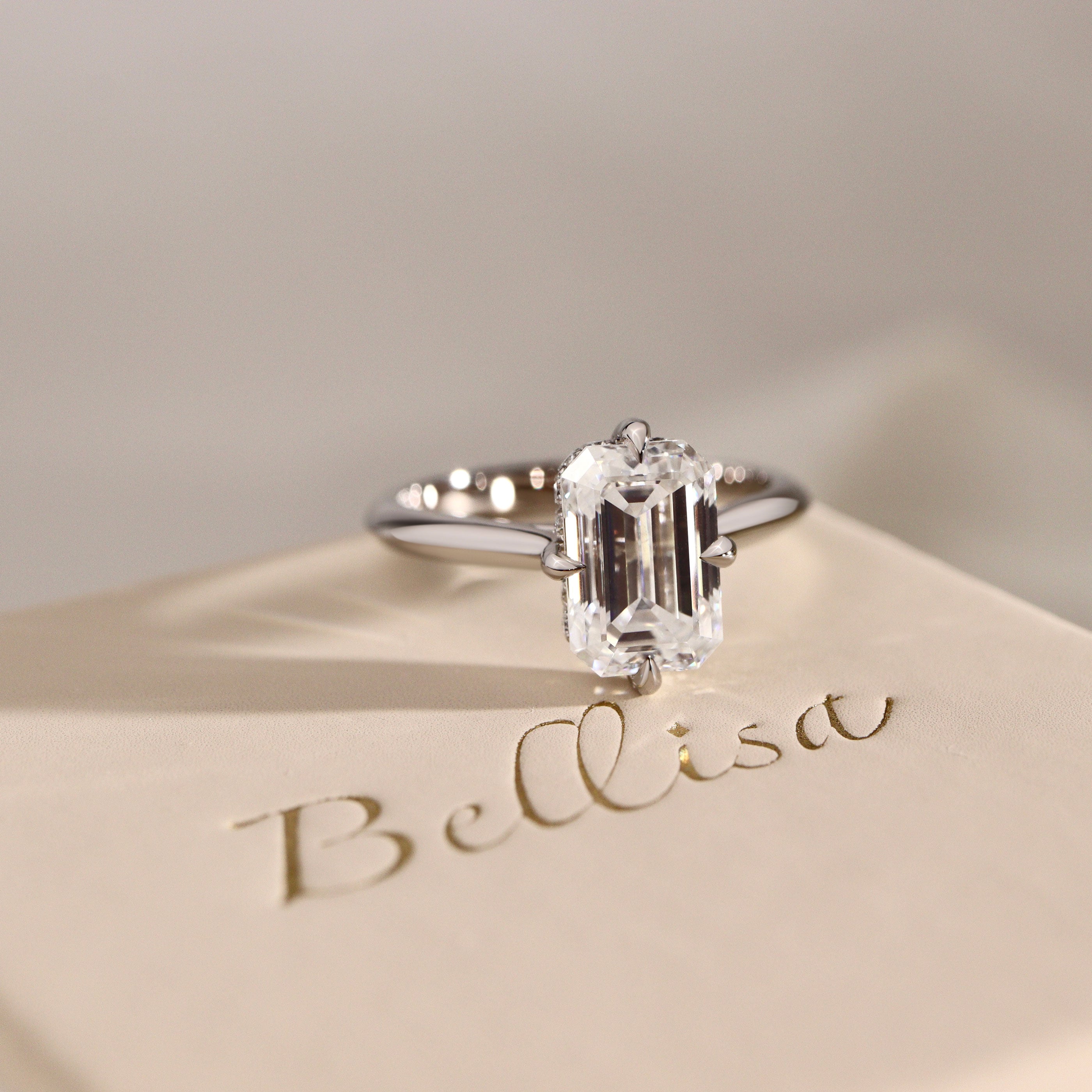 Jodie Compass Emerald Cut Hidden Halo Engagement Ring