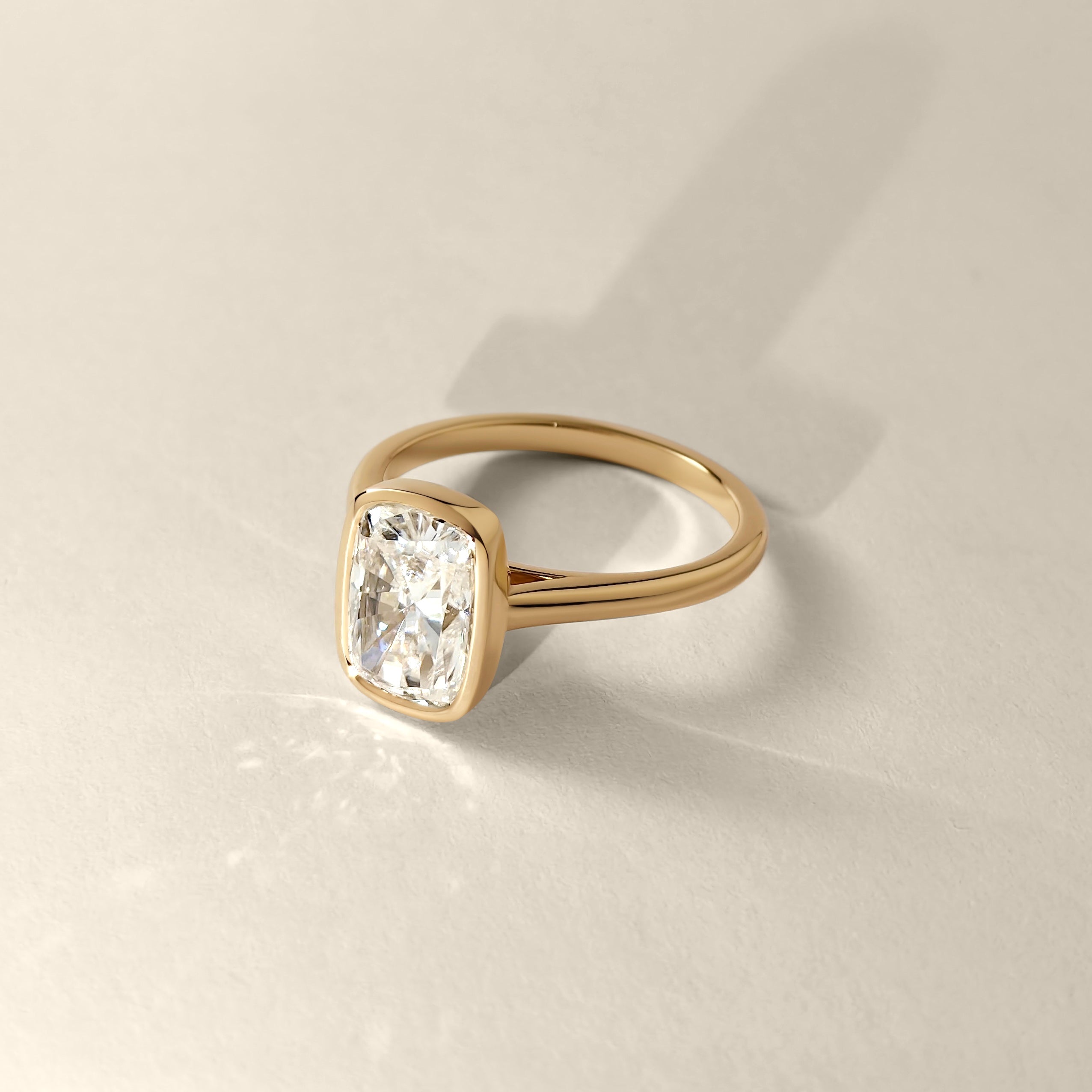 Carmen Elongated Cushion Bezel Solitaire Cathedral Engagement Ring