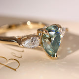 Purity Petal Hidden Halo Three Stone Engagement Ring, Cyan Green Moissanite