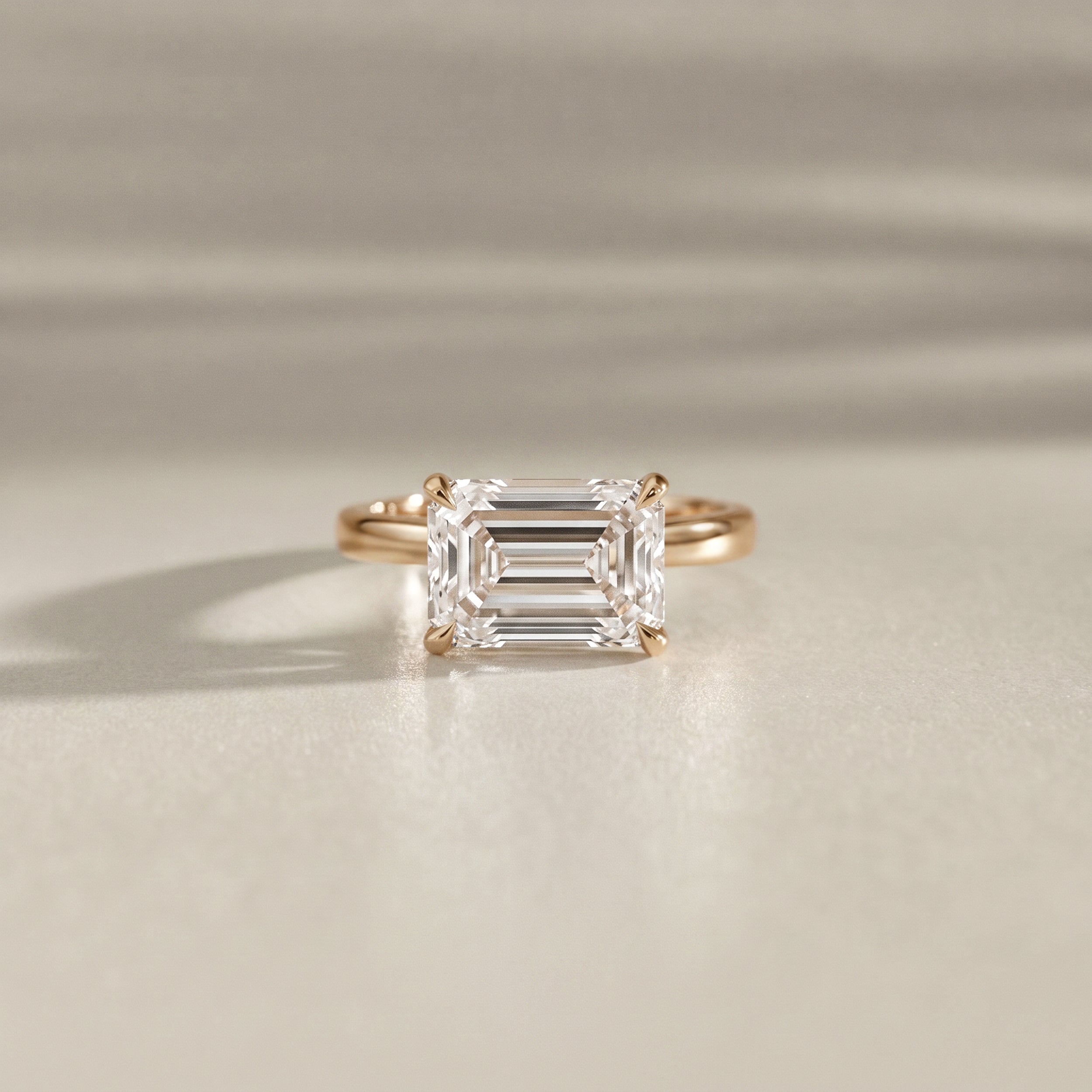 Lyra East West Emerald Cut Solitaire Cathedral Engagement Ring