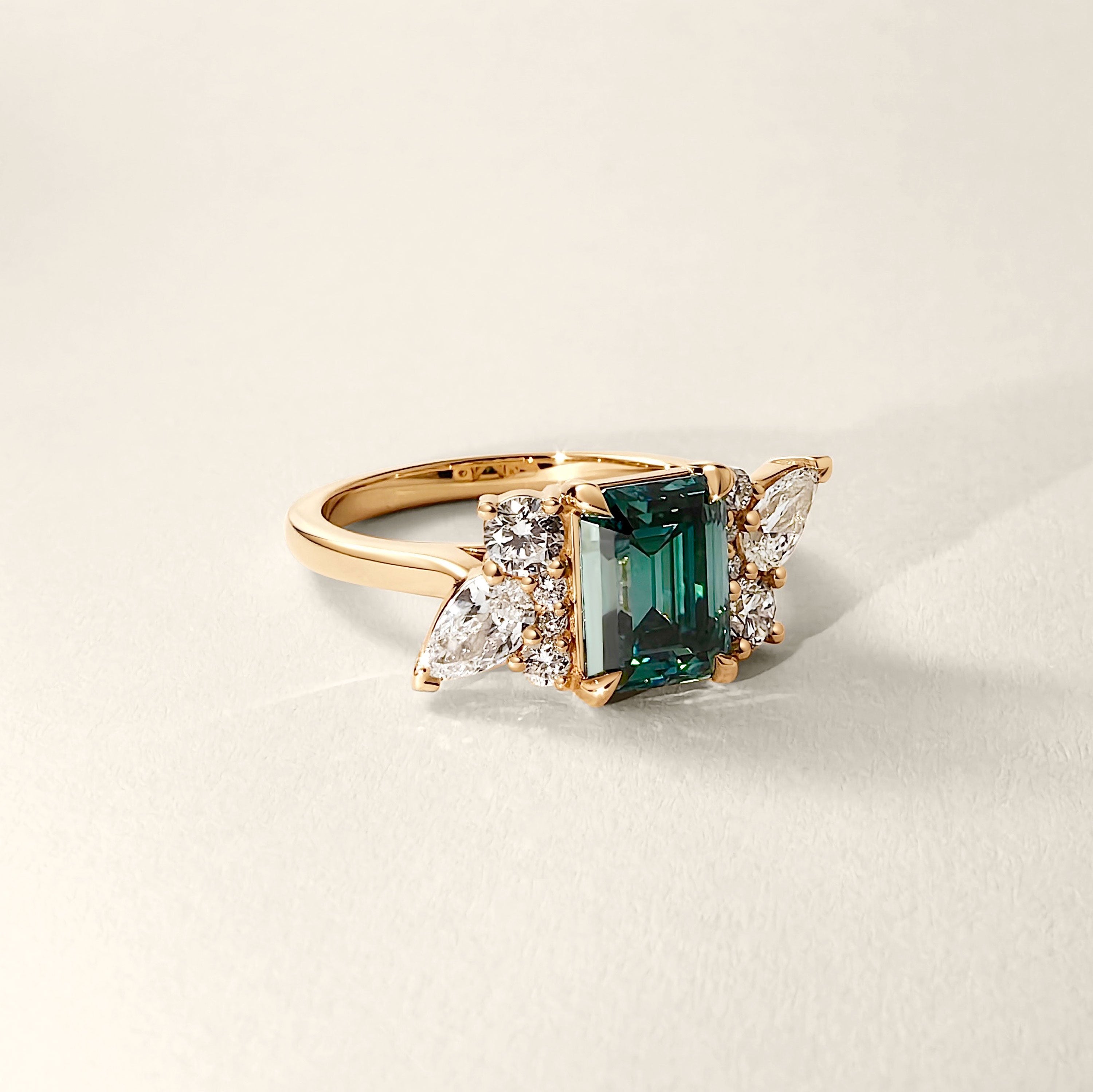 Meghan Emerald Cut Asymmetric Cluster Engagement Ring