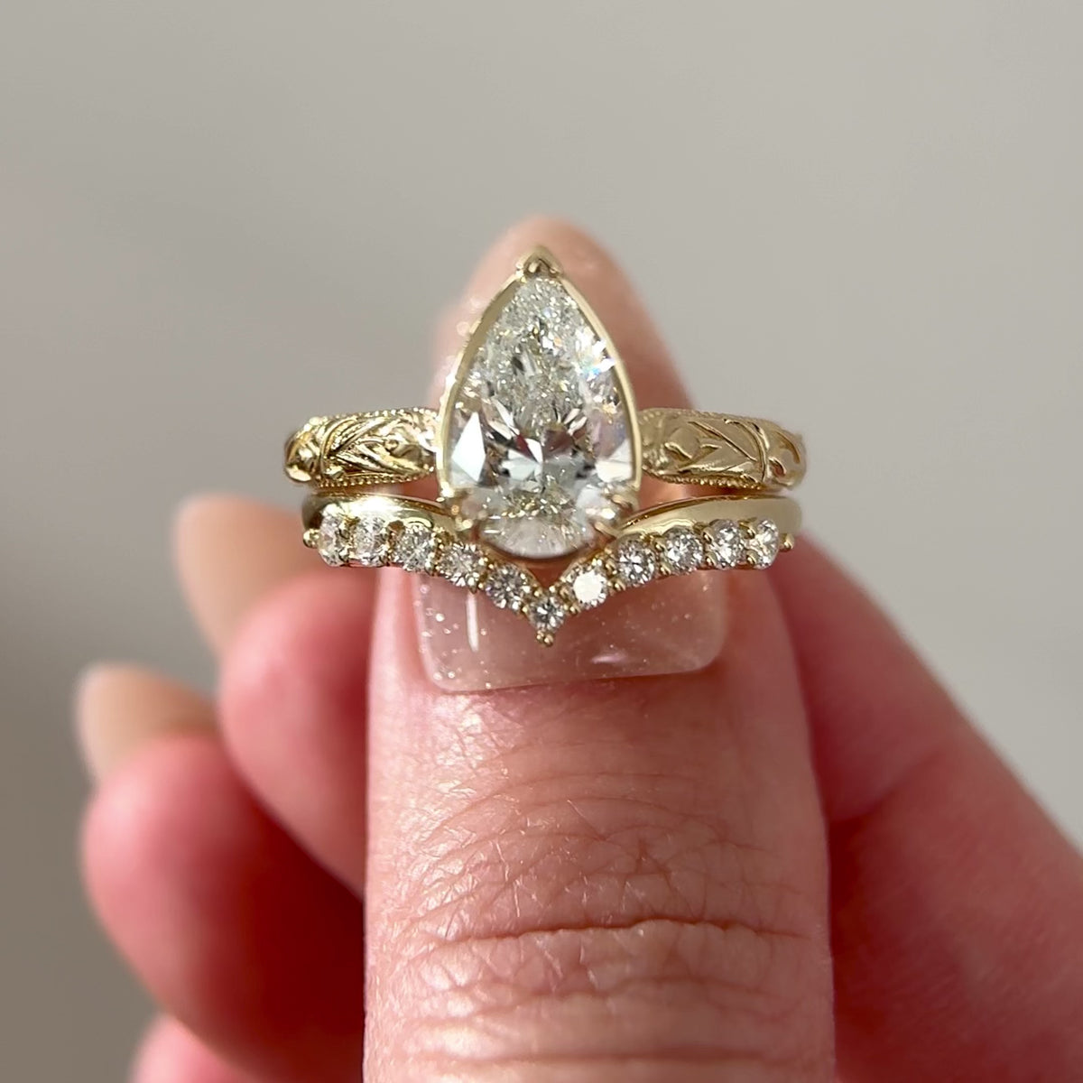 Pear-Diamond-Tulip-Inspired-Cathedral-Engagement-Ring with matching band