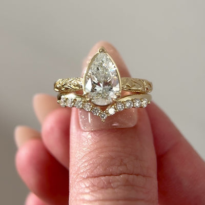 Pear-Diamond-Tulip-Inspired-Cathedral-Engagement-Ring with matching band