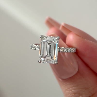 3ct emerald cut lab diamond hidden halo engagement ring with pave band in platinum