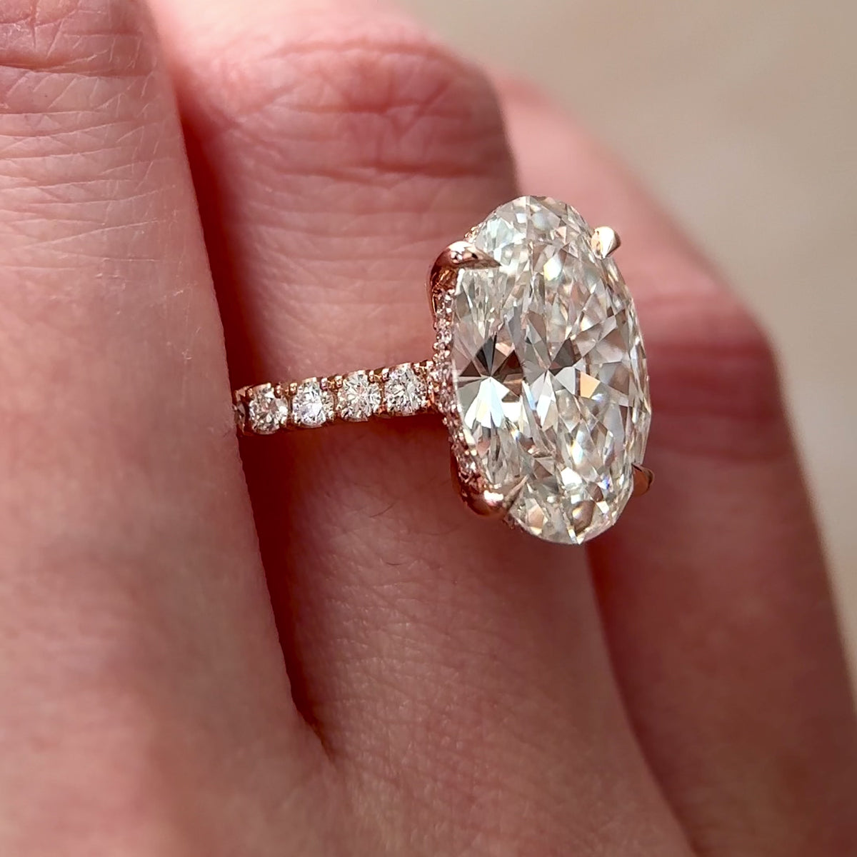 oval lab grown diamond hidden halo cathedral engagement ring