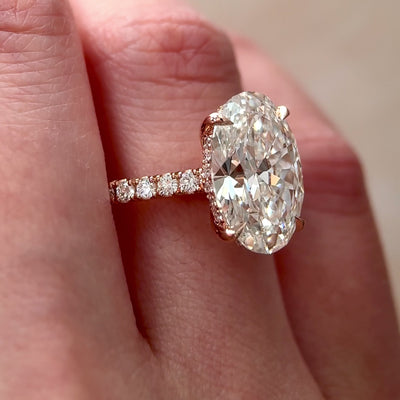 oval lab grown diamond hidden halo cathedral engagement ring
