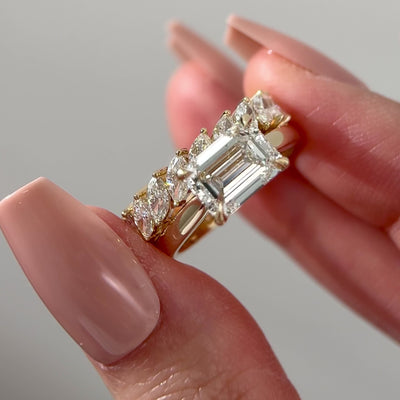 emerald cut diamond east west cathedral solitaire engagement ring with marquise diamond wedding band set 