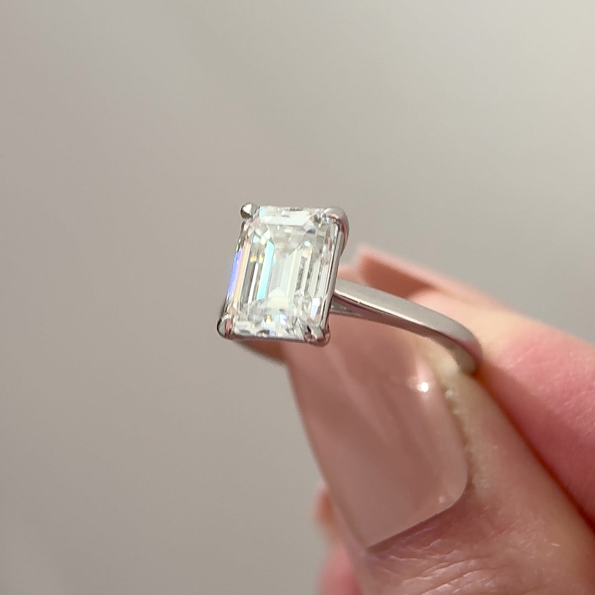 emerald cut moissanite cathedral engagement ring