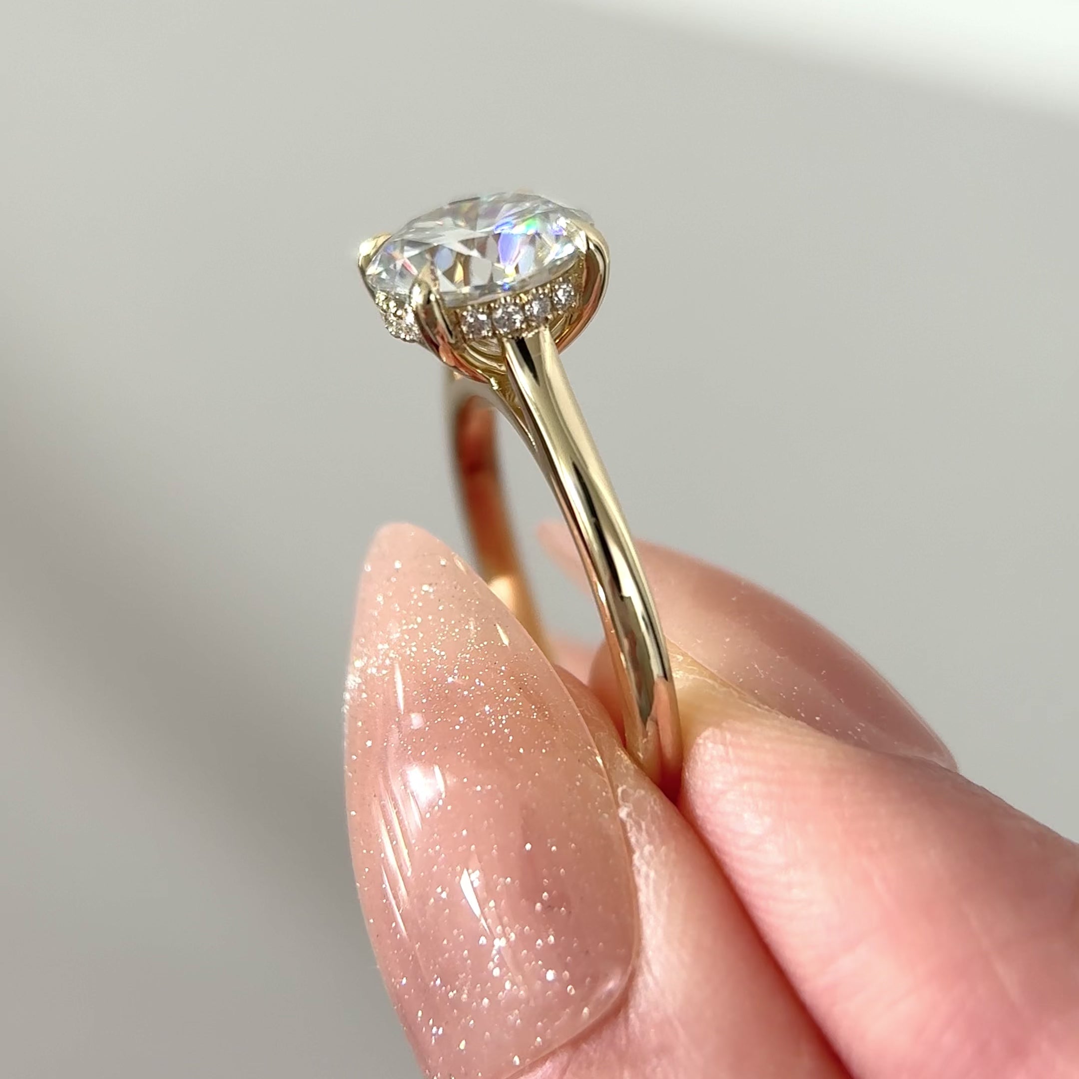 round moissanite hidden halo cathedral engagement ring
